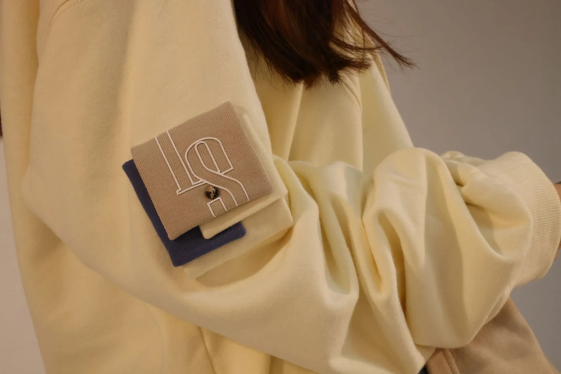 Close-up of the three-layer LS sleeve pocket with a snap button