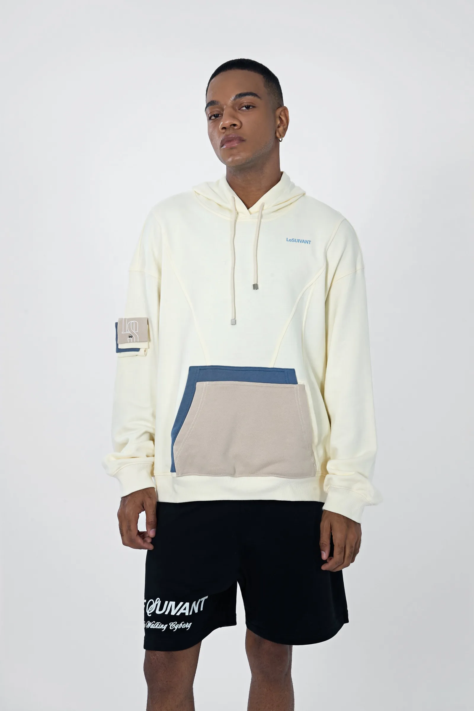 Studio shot of the Cream White Hoodie front with the kangaroo pocket and sleeve pocket