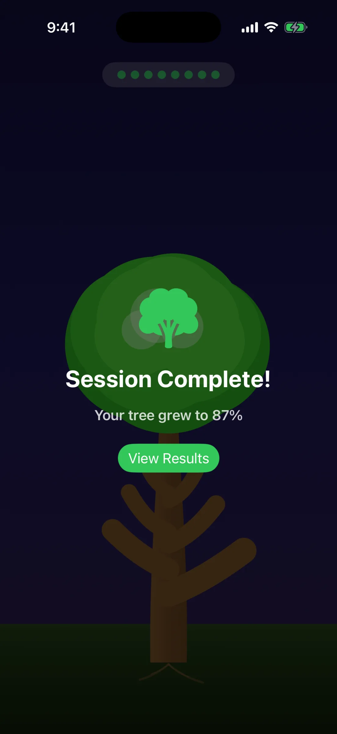 Session complete overlay at night: a tree glyph, ‘Session Complete!’, ‘Your tree grew to 87%’ and a View Results button over a dimmed oak.