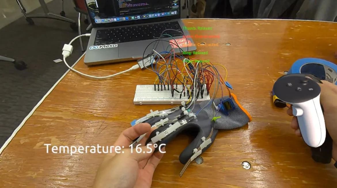 Mixed-reality passthrough view of the glove and breadboard on a desk next to a laptop and a Quest controller, reading “Temperature: 16.5°C” with finger-state labels.