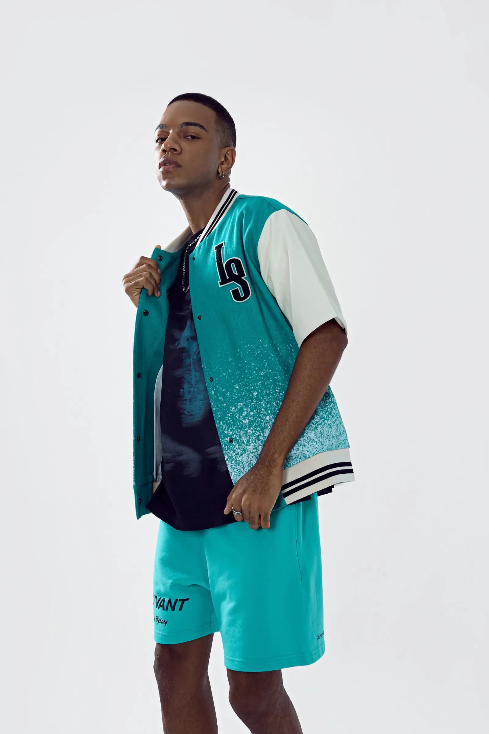Model holding the collar of the open Chip Body bomber, three-quarter view