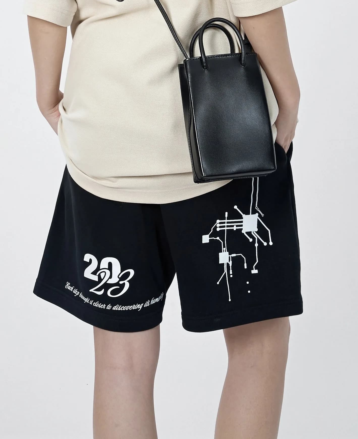 Close-up of the black Cyborg Classic shorts back with the white 2023 script and motherboard print